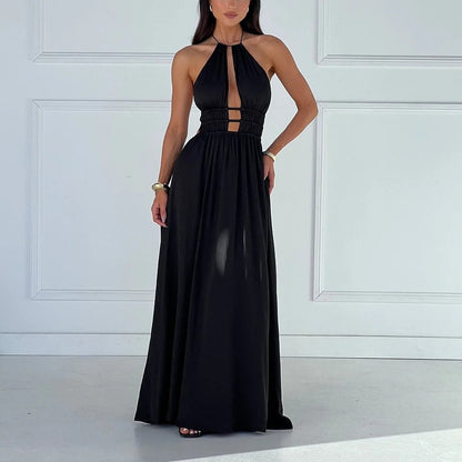 Black halter maxi dress with cut-out details on a white background room