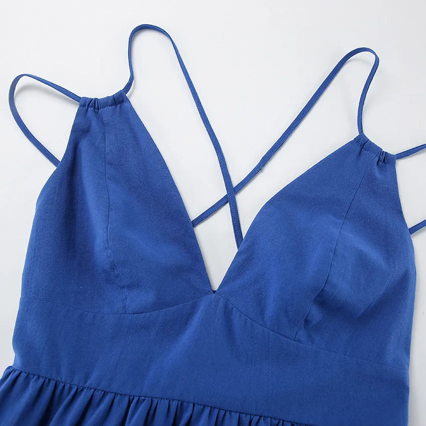 Close-up of a blue maxi dress with thin straps on a white background